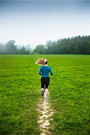 running woman in a park - Mature woman running in countryside Stock Photo - Premium Royalty-Free, Code: 649-07280680