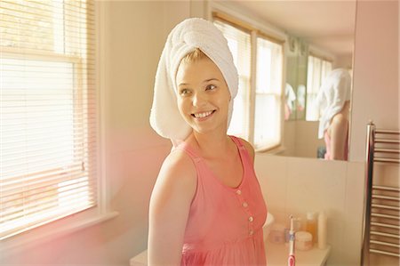 Young woman standing in bathroom Stock Photo - Premium Royalty-Free, Code: 649-07280713