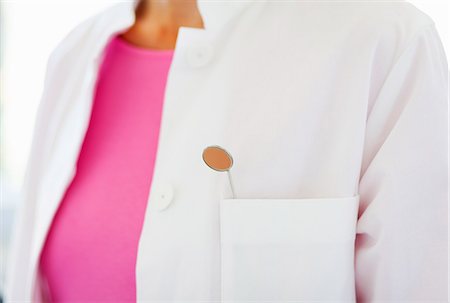 fiable - Close up of dental mirror in dentists pocket Photographie de stock - Premium Libres de Droits, Code: 649-07280870