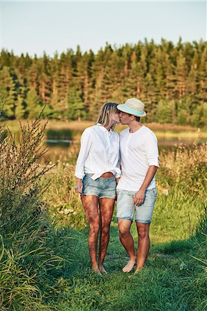 fir trees - Romantic young couple kissing, Gavle, Sweden Stock Photo - Premium Royalty-Free, Code: 649-07280966