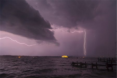 storm not jet not plane not damage not house not people - View of storm and lightning on Lake Starnberg, Bavaria, Germany Stock Photo - Premium Royalty-Free, Code: 649-07280998