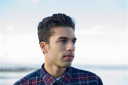 portrait looking away - Young man wearing checked shirt Stock Photo - Premium Royalty-Free, Code: 649-07281010