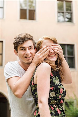 Young man covering girlfriend's eyes Stock Photo - Premium Royalty-Free, Code: 649-07436303