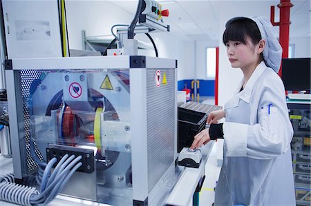 Worker at small parts manufacturing factory in China Stock Photo - Premium Royalty-Free, Code: 649-07436340