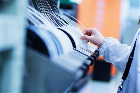 Worker at small parts manufacturing factory in China Stock Photo - Premium Royalty-Free, Code: 649-07436351