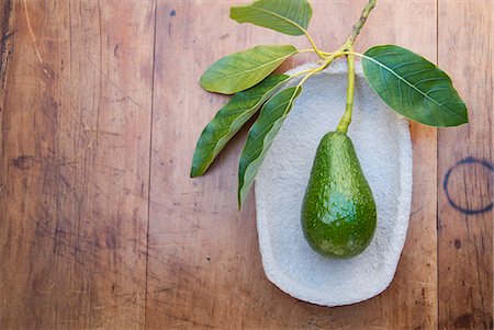 Avocado on plate Stock Photo - Premium Royalty-Free, Code: 649-07436371