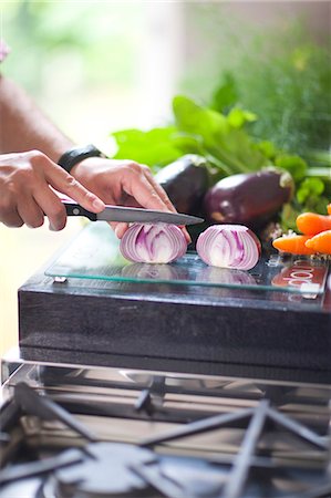 Chopped composition, hand chopping red onion Stock Photo - Premium Royalty-Free, Code: 649-07436539