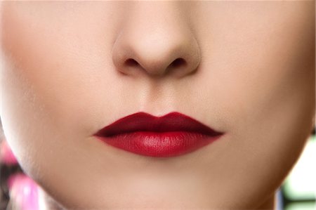 fünf sinne - Cropped studio portrait of young woman's lips Stockbilder - Premium RF Lizenzfrei, Bildnummer: 649-07436636