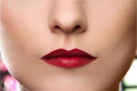 rossetto - Cropped studio portrait of young woman's lips Fotografie stock - Premium Royalty-Free, Codice: 649-07436636