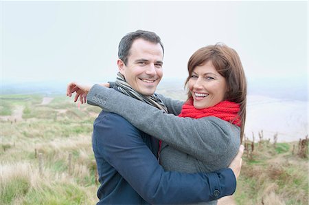 red scarf woman - Couple hugging by coast Stock Photo - Premium Royalty-Free, Code: 649-07436732