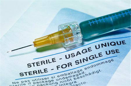 disposable - Disposable plastic medical syringe with a hypodermic needle Stock Photo - Premium Royalty-Free, Code: 649-07436755