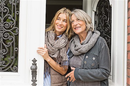 Mother and daughter by front door Stock Photo - Premium Royalty-Free, Code: 649-07436811