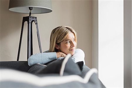 Portrait of mid adult woman looking away Stock Photo - Premium Royalty-Free, Code: 649-07436837