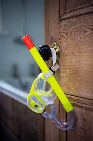 door to bathroom - Open bathroom door with hanging snorkel and goggles Stock Photo - Premium Royalty-Free, Code: 649-07437029