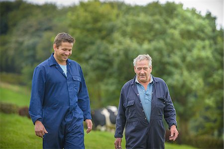 Farmer and son walking together in field Stock Photo - Premium Royalty-Free, Code: 649-07437082