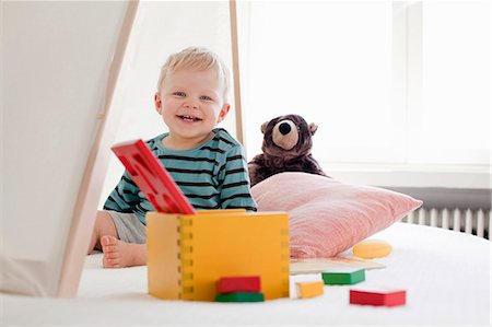 smiling baby portrait - Happy little boy with toys Stock Photo - Premium Royalty-Free, Code: 649-07437098