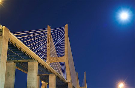 suspended bridge - Close up of Vasco da Gama Bridge at night, Lisbon, Portugal Stock Photo - Premium Royalty-Free, Code: 649-07437152