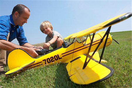 remote - Father and son preparing model plane Stock Photo - Premium Royalty-Free, Code: 649-07437346