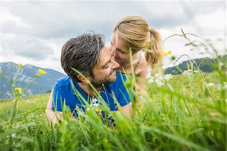 ponytail man - Couple enjoying the meadow Stock Photo - Premium Royalty-Free, Code: 649-07437365