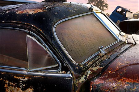 salvage yard classics cars - Close up of vintage car in scrap yard Stock Photo - Premium Royalty-Free, Code: 649-07437393