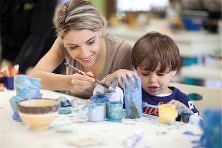 elementary students and teacher - Teacher and toddler playing in art class Stock Photo - Premium Royalty-Free, Code: 649-07437443