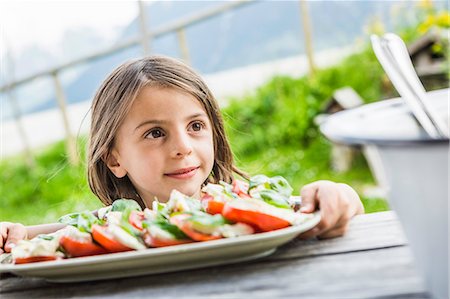 summer meal - Young girl holding salad plate for picnic lunch, Tyrol, Austria Stock Photo - Premium Royalty-Free, Code: 649-07437621