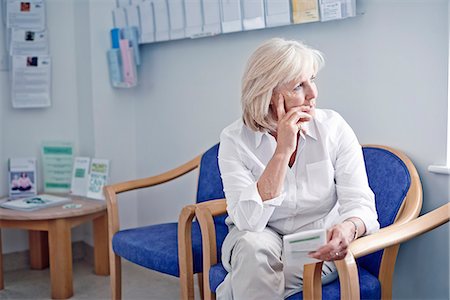 sick looking adult in hospital - Mature female patient in hospital waiting room Stock Photo - Premium Royalty-Free, Code: 649-07437697