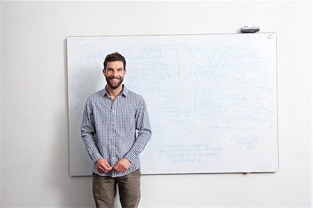 Businessman in front of whiteboard Stock Photo - Premium Royalty-Free, Code: 649-07437791
