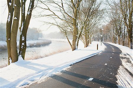 snowy river - Rural road cleared of snow in winter Stock Photo - Premium Royalty-Free, Code: 649-07437941