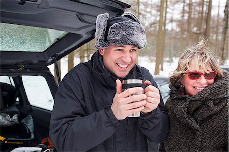 senior winter adult family - Mother and son having hot drink outside in winter Stock Photo - Premium Royalty-Free, Code: 649-07437962