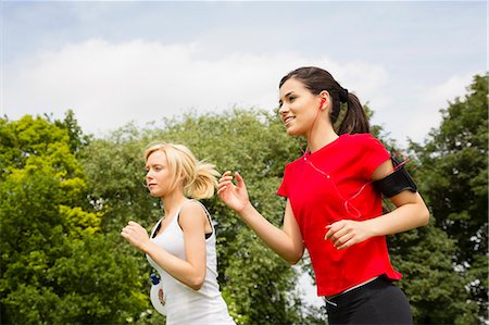 running blonde woman - Women jogging through park Stock Photo - Premium Royalty-Free, Code: 649-07438058