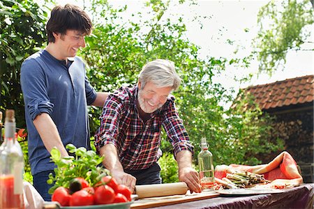 simsearch:649-07239718,k - Father and adult son making pizza Stock Photo - Premium Royalty-Free, Code: 649-07438099