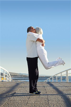 Man lifting woman up Stock Photo - Premium Royalty-Free, Code: 649-07520144