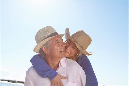 escapism - Couple wearing straw hats on beach Stock Photo - Premium Royalty-Free, Code: 649-07520164