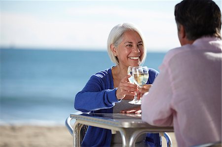 Couple enjoying wine by seaside Stock Photo - Premium Royalty-Free, Code: 649-07520160