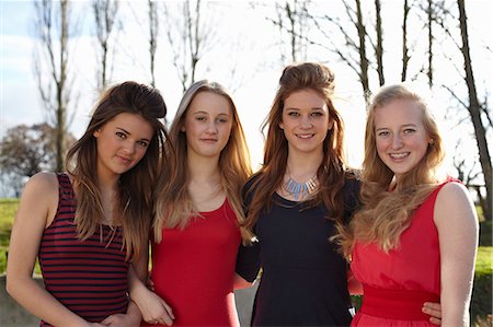 Portrait of four teenage girls dressed for party Stock Photo - Premium Royalty-Free, Code: 649-07520275