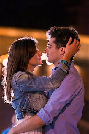 paris street lights at night - Young couple embracing at night, Paris, France Stock Photo - Premium Royalty-Free, Code: 649-07520325