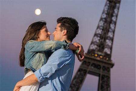 eiffel tower tourist - Young couple embracing in moonlight, Paris, France Stock Photo - Premium Royalty-Free, Code: 649-07520322