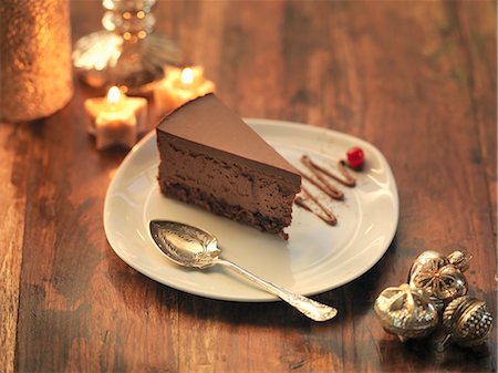 slice - Chocolate and chestnut torte amongst festive decorations Stock Photo - Premium Royalty-Free, Code: 649-07520382