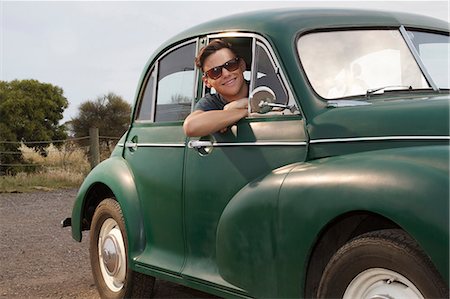 rural man - Portrait of young man in vintage morris minor Stock Photo - Premium Royalty-Free, Code: 649-07520610