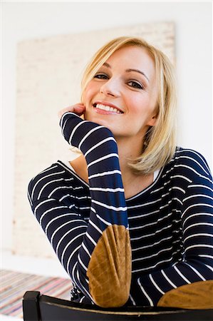 single woman studio white - Studio portrait of young woman in stripes Stock Photo - Premium Royalty-Free, Code: 649-07520630