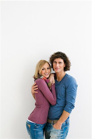 simsearch:649-07520662,k - Studio portrait of loving couple Photographie de stock - Premium Libres de Droits, Code: 649-07520660