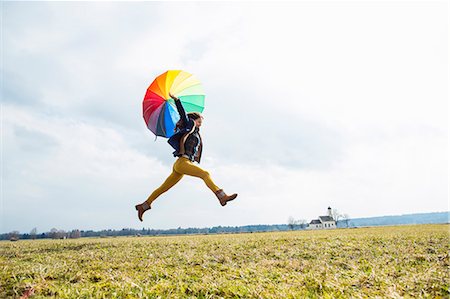 schirm - Teenage girl in field with umbrella Stockbilder - Premium RF Lizenzfrei, Bildnummer: 649-07520738