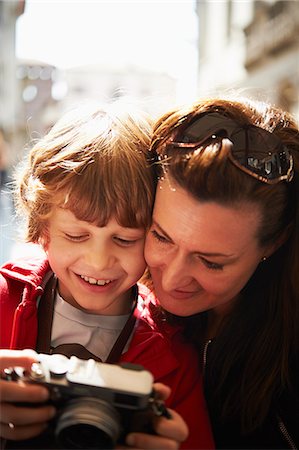 Mother and son checking photographs on camera Stock Photo - Premium Royalty-Free, Code: 649-07520756