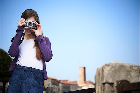 preteen skirts - Girl taking photograph, Province of Venice, Italy Stock Photo - Premium Royalty-Free, Code: 649-07520766