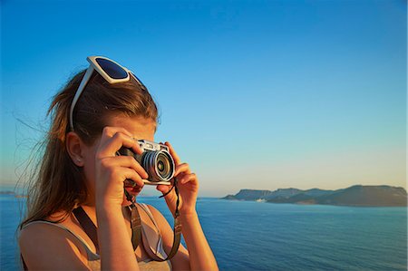 scenery children not illustration - Girl taking photographs on holiday, Kas, Turkey Foto de stock - Sin royalties Premium, Código: 649-07520774