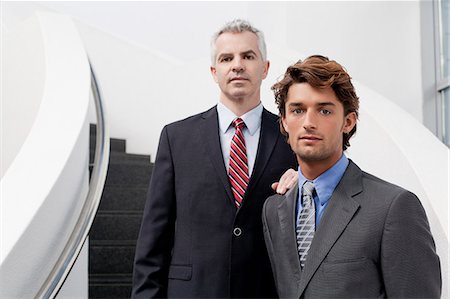dos (cantidad) - Portrait of two businessmen on office stairs Foto de stock - Sin royalties Premium, Código: 649-07520779