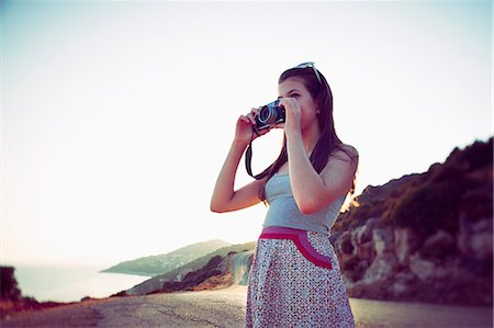 Girl taking photographs at dusk, Kas, Turkey Foto de stock - Sin royalties Premium, Código: 649-07520771