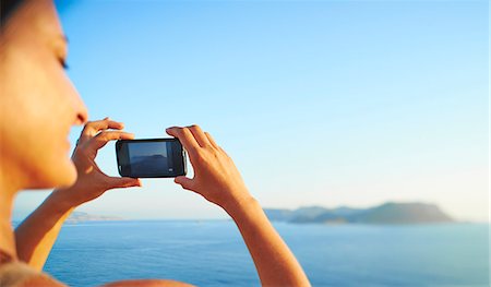 Mature woman checking photographs on smartphone, Kas, Turkey Stock Photo - Premium Royalty-Free, Code: 649-07520772