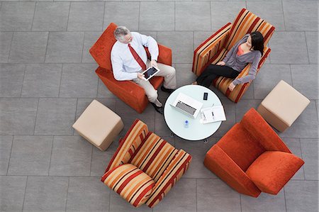 elevated view of a confident businesswoman - Overhead view of interview in office atrium Stock Photo - Premium Royalty-Free, Code: 649-07520785